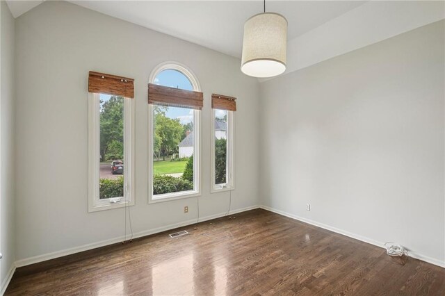 12909 Maple St, Overland Park, KS 66209 - spare room featuring dark wood-type flooring