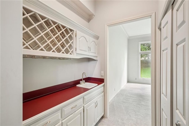 12909 Maple St, Overland Park, KS 66209 - indoor wet bar featuring light colored carpet and crown molding