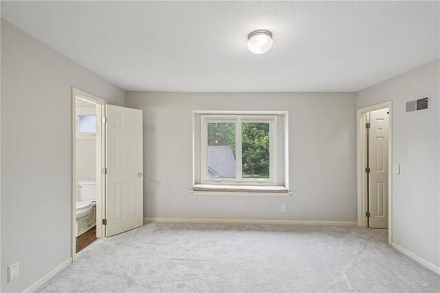 12909 Maple St, Overland Park, KS 66209 - unfurnished bedroom featuring carpet floors and ensuite bath