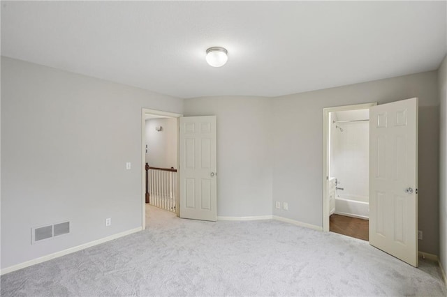 12909 Maple St, Overland Park, KS 66209 - unfurnished bedroom featuring carpet floors and baseboards