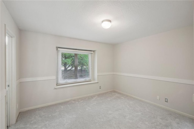 12909 Maple St, Overland Park, KS 66209 - empty room featuring carpet flooring and a textured ceiling