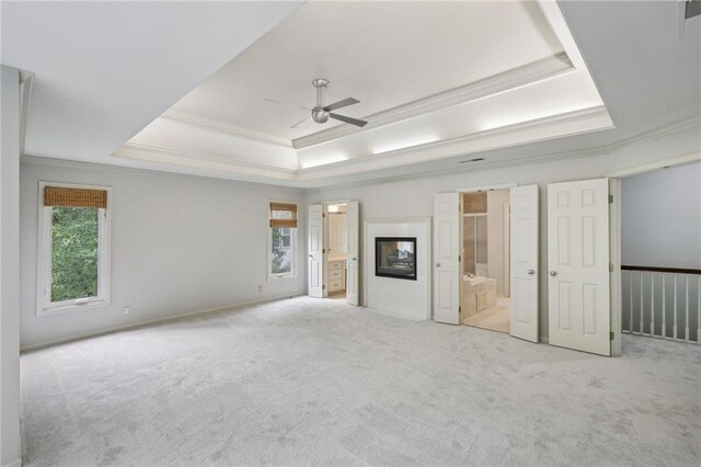 12909 Maple St, Overland Park, KS 66209 - unfurnished bedroom featuring connected bathroom, carpet floors, a tray ceiling, and ornamental molding