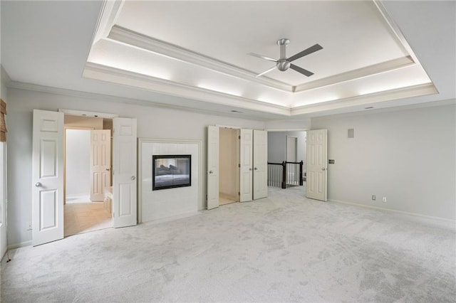 12909 Maple St, Overland Park, KS 66209 - unfurnished bedroom with a tray ceiling, light colored carpet, and ornamental molding