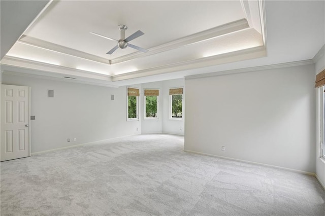 12909 Maple St, Overland Park, KS 66209 - spare room with a tray ceiling, ceiling fan, carpet, and ornamental molding