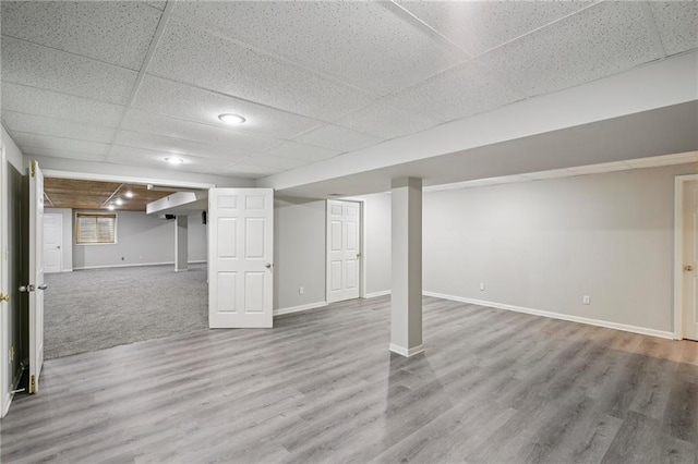 12909 Maple St, Overland Park, KS 66209 - finished below grade area featuring a paneled ceiling and wood finished floors