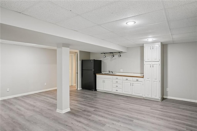 12909 Maple St, Overland Park, KS 66209 - indoor bar with freestanding refrigerator, light wood-style floors, and a paneled ceiling