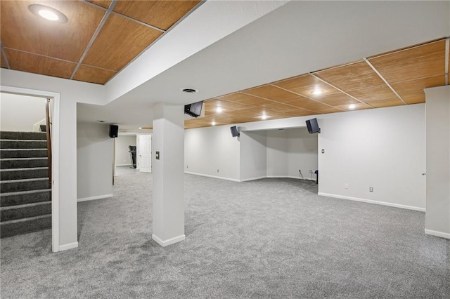 12909 Maple St, Overland Park, KS 66209 - finished below grade area with carpet floors, stairs, and wood ceiling