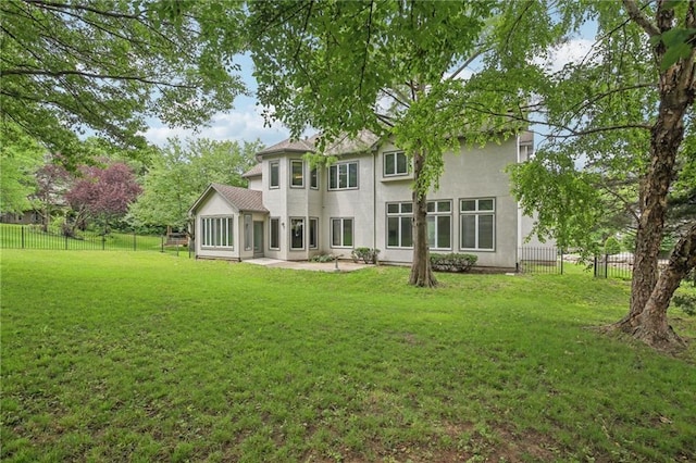 12909 Maple St, Overland Park, KS 66209 - rear view of property with stucco siding, a fenced backyard, and a patio area