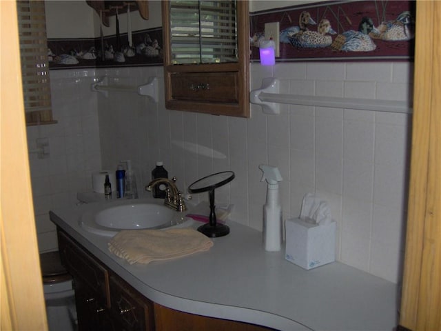 3016 S Northern Blvd, Independence, MO 64052 - half bath with vanity, backsplash, and tile walls