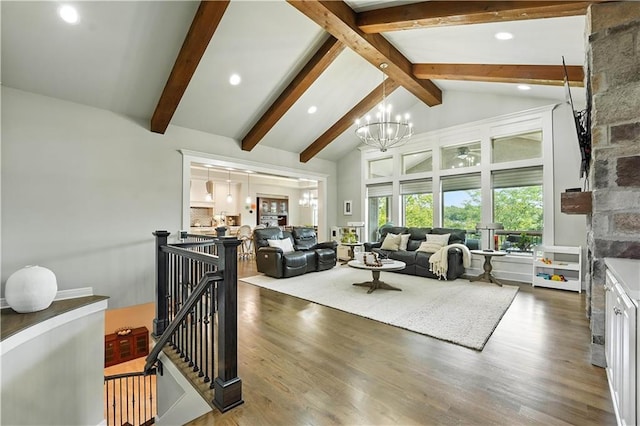 27181 W 100th Ter, Olathe, KS 66061 - living area with a chandelier, wood finished floors, beam ceiling, high vaulted ceiling, and recessed lighting