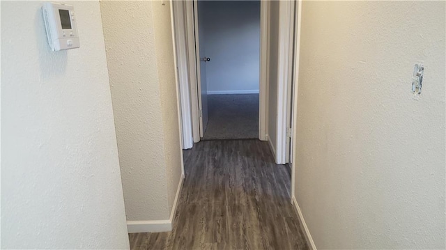 8304 E 111th St, Kansas City, MO 64134 - corridor with dark wood-type flooring and a textured wall