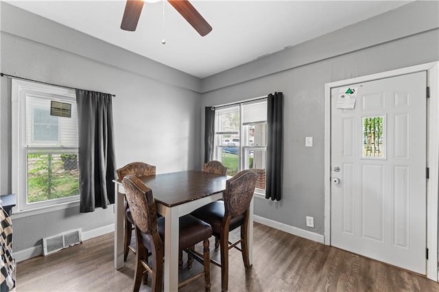218 N 25th St, Kansas City, KS 66102 - dining room with plenty of natural light, wood finished floors, and ceiling fan