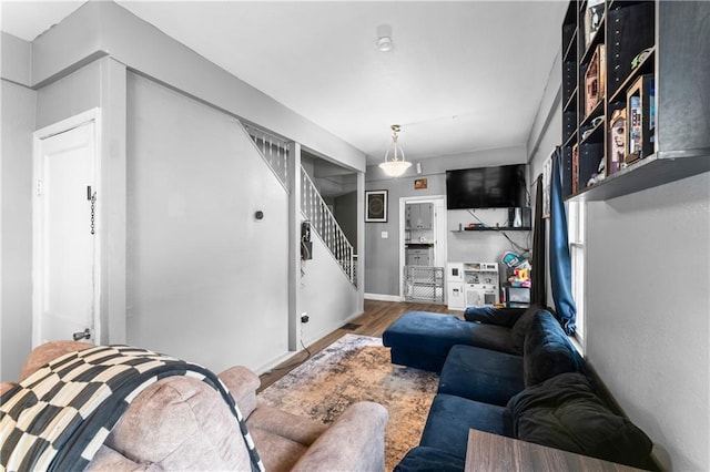 218 N 25th St, Kansas City, KS 66102 - living area featuring wood finished floors and stairway