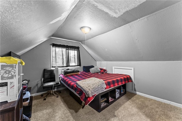 218 N 25th St, Kansas City, KS 66102 - bedroom featuring carpet, vaulted ceiling, and a textured ceiling
