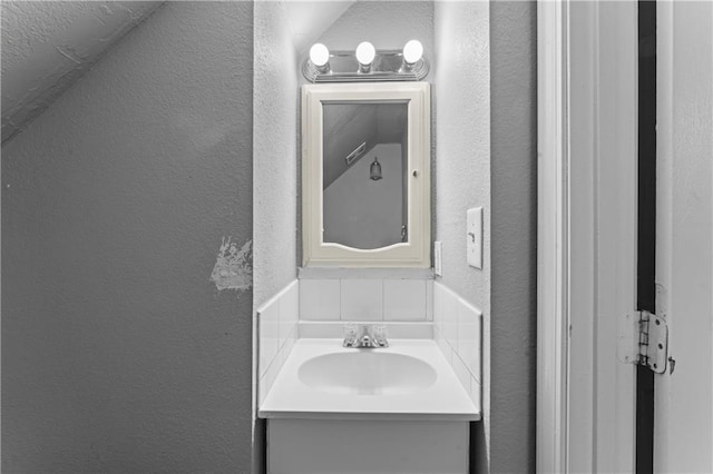 218 N 25th St, Kansas City, KS 66102 - bathroom with a textured wall and vanity