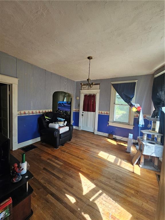 3114 Messanie St, Saint Joseph, MO 64501 - living area featuring hardwood / wood-style floors and a textured ceiling