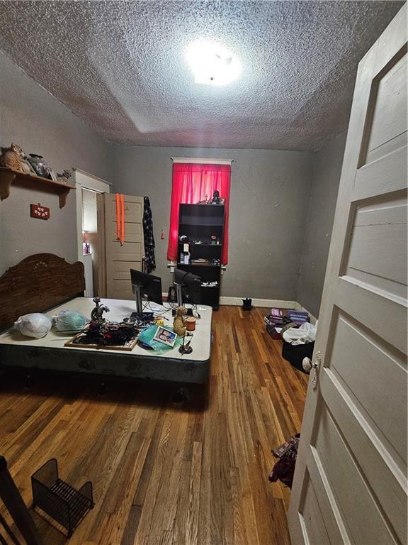 3114 Messanie St, Saint Joseph, MO 64501 - bedroom with wood finished floors and a textured ceiling