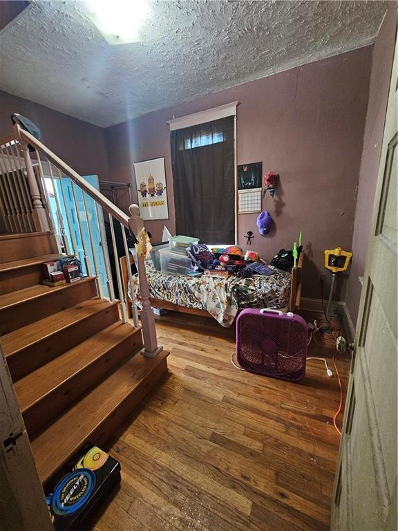 3114 Messanie St, Saint Joseph, MO 64501 - bedroom with a textured ceiling and hardwood / wood-style flooring