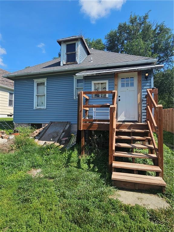 3114 Messanie St, Saint Joseph, MO 64501 - back of property with roof with shingles and a wooden deck