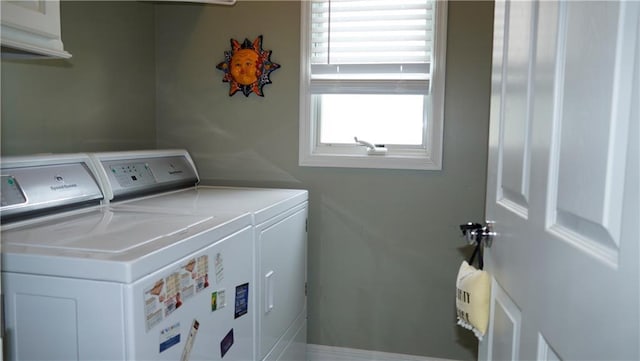 14780 S Glen Eyrie St, Olathe, KS 66061 - laundry area featuring washing machine and dryer and cabinet space