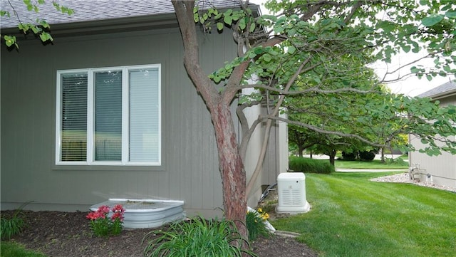 14780 S Glen Eyrie St, Olathe, KS 66061 - view of home's exterior with a shingled roof and a lawn