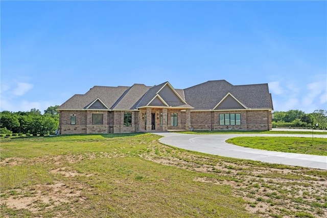 18405 371st Hwy, Platte City, MO 64079 - view of front facade with a front lawn, curved driveway, and brick siding