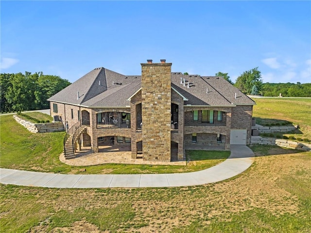 18405 371st Hwy, Platte City, MO 64079 - back of property with stairs, a chimney, a lawn, and a patio area
