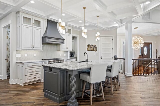 18405 371st Hwy, Platte City, MO 64079 - kitchen featuring premium range hood, dark wood-type flooring, coffered ceiling, an island with sink, and recessed lighting
