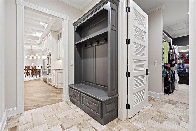 18405 371st Hwy, Platte City, MO 64079 - mudroom featuring crown molding, stone tile flooring, and a chandelier