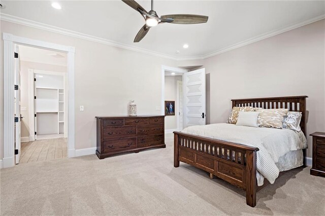 18405 371st Hwy, Platte City, MO 64079 - carpeted bedroom featuring ornamental molding, recessed lighting, a ceiling fan, and a spacious closet