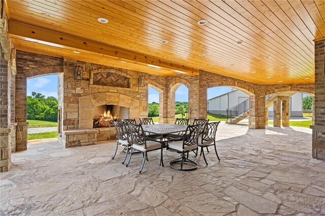 18405 371st Hwy, Platte City, MO 64079 - view of patio featuring an outdoor stone fireplace, stairway, and outdoor dining area