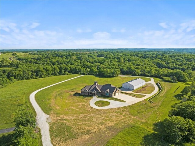 18405 371st Hwy, Platte City, MO 64079 - aerial view of property and surrounding area featuring a heavily wooded area