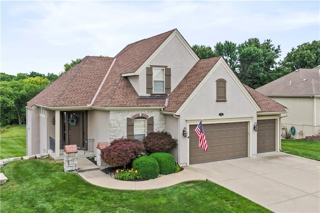 4204 SW Duck Pond Dr, Lees Summit, MO 64082 - view of front of home with stucco siding, a front yard, concrete driveway, stone siding, and a garage