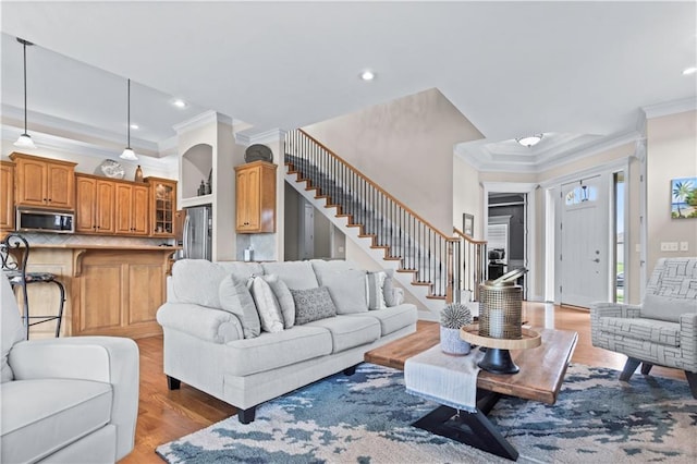 4204 SW Duck Pond Dr, Lees Summit, MO 64082 - living room featuring ornamental molding, stairway, light wood-style flooring, and recessed lighting