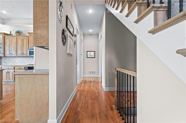 4204 SW Duck Pond Dr, Lees Summit, MO 64082 - hallway featuring light wood-style flooring, crown molding, and recessed lighting