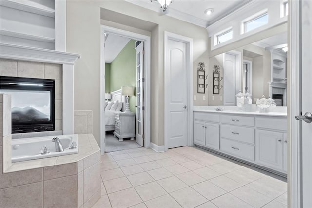 4204 SW Duck Pond Dr, Lees Summit, MO 64082 - ensuite bathroom with ornamental molding, a fireplace, vanity, a bath, and tile patterned floors