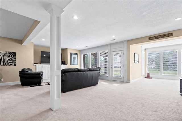 4204 SW Duck Pond Dr, Lees Summit, MO 64082 - living room featuring light colored carpet, a textured ceiling, healthy amount of natural light, and recessed lighting