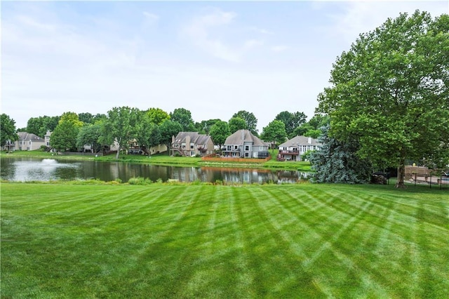 4204 SW Duck Pond Dr, Lees Summit, MO 64082 - view of grassy yard with a water view and a residential view