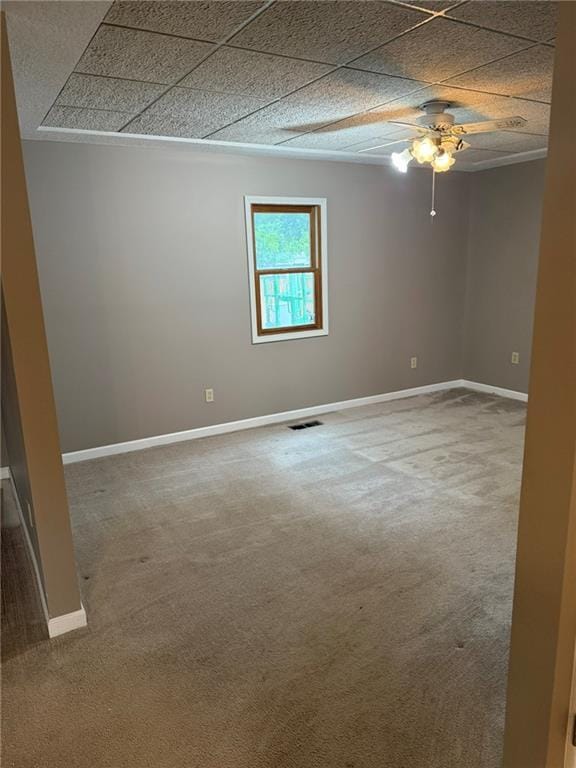 915 Des Moines St, Burlington, KS 66839 - carpeted spare room featuring a ceiling fan and a paneled ceiling