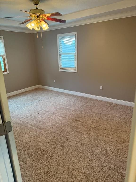 915 Des Moines St, Burlington, KS 66839 - spare room featuring crown molding, a ceiling fan, and light colored carpet