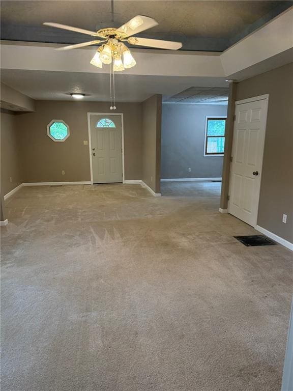 915 Des Moines St, Burlington, KS 66839 - entrance foyer with ceiling fan and light carpet