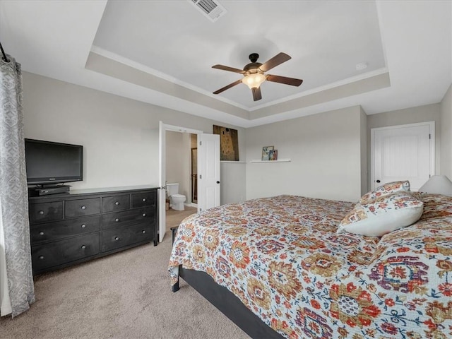 21818 W 123rd Ter, Olathe, KS 66061 - bedroom with a raised ceiling, light colored carpet, ceiling fan, and connected bathroom