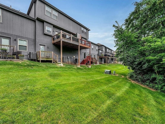 21818 W 123rd Ter, Olathe, KS 66061 - rear view of property with a lawn and stairway