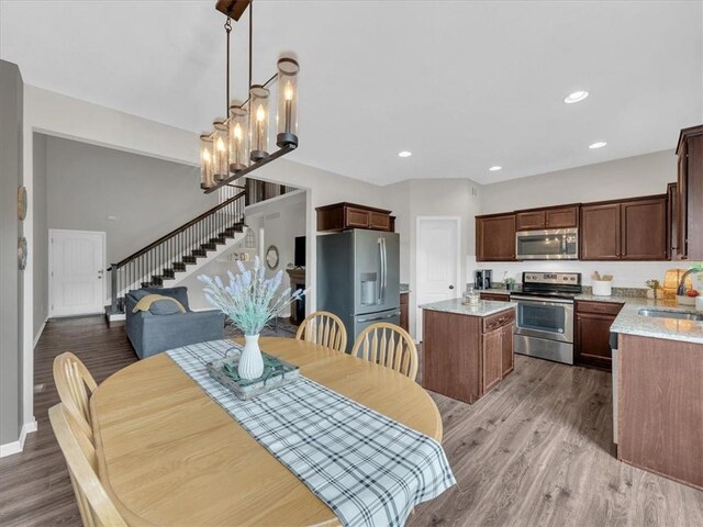 21818 W 123rd Ter, Olathe, KS 66061 - dining area featuring stairway, light wood-style floors, and recessed lighting