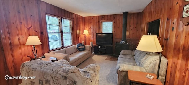 28767 Parkway Dr, Warsaw, MO 65355 - carpeted living area with wooden walls and a wood stove