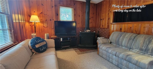 28767 Parkway Dr, Warsaw, MO 65355 - carpeted living area featuring wooden walls and a wood stove