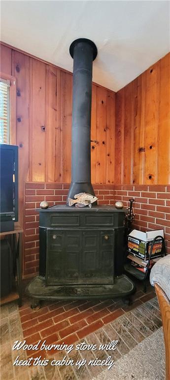 28767 Parkway Dr, Warsaw, MO 65355 - detailed view of a wood stove and wooden walls