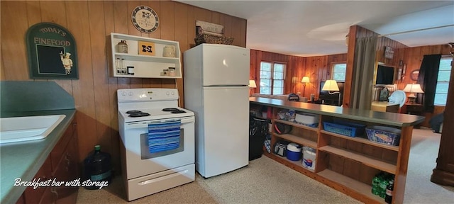 28767 Parkway Dr, Warsaw, MO 65355 - kitchen featuring white appliances and wooden walls