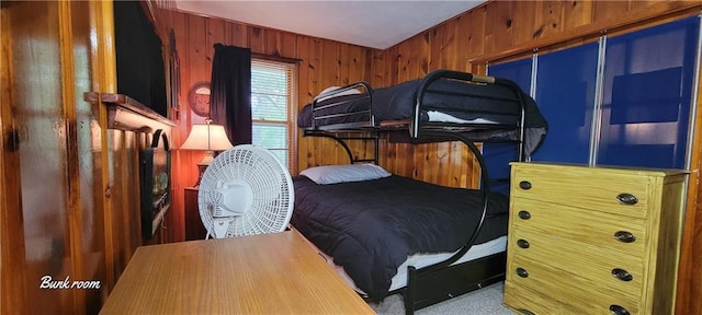 28767 Parkway Dr, Warsaw, MO 65355 - bedroom with wood walls and carpet flooring