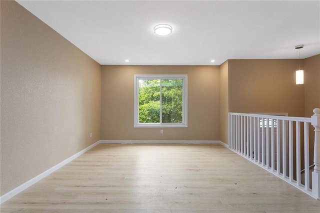 113 SW 21st St, Oak Grove, MO 64075 - unfurnished room with light wood-style floors and baseboards